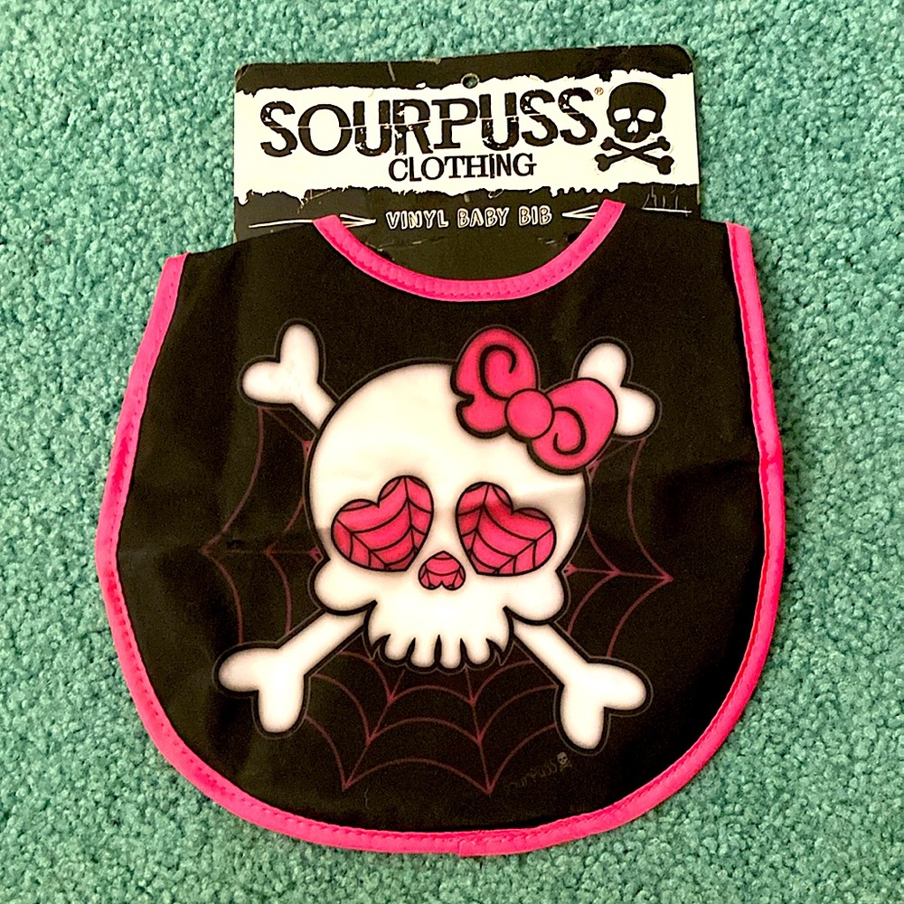 Sourpuss black vinyl baby bib with girlie skull and cross-bones, spider webs